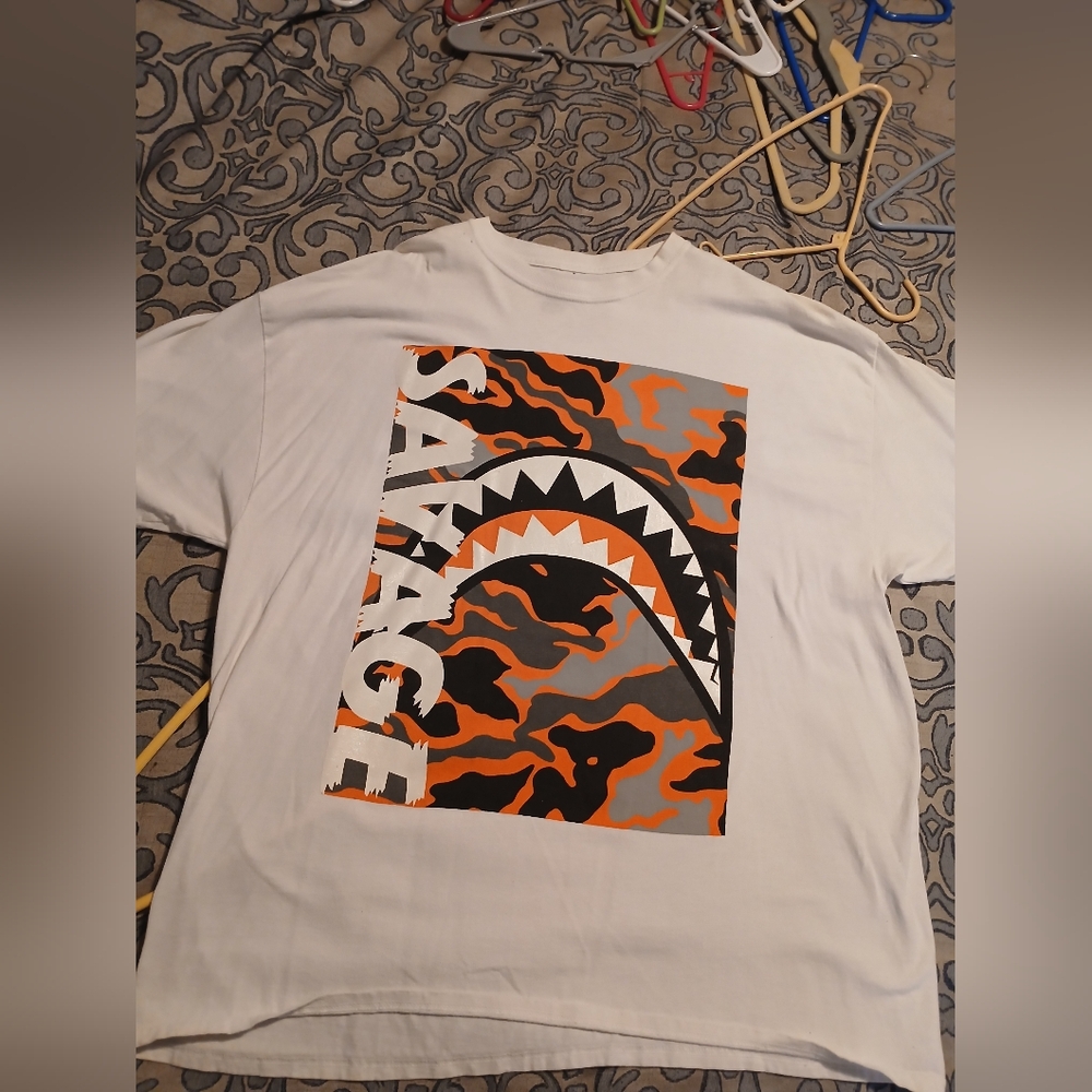 White Graphic Tee with Orange and Black Design